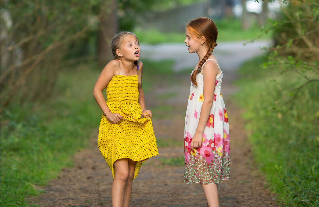 Two young girls having a conversation.